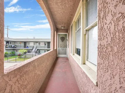 a view of balcony with furniture