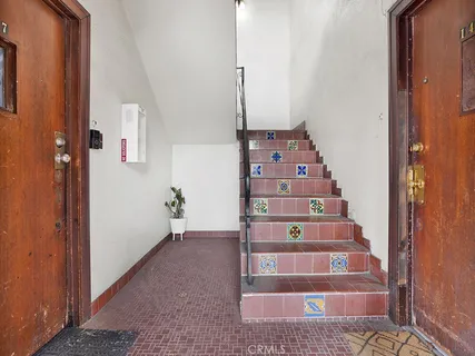 a view of staircase with white walls