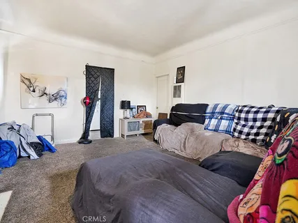 a bedroom with furniture and a couch