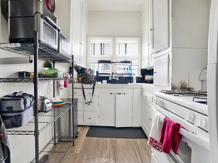 a kitchen with a stove oven and sink