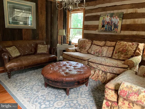 a living room with furniture and a rug