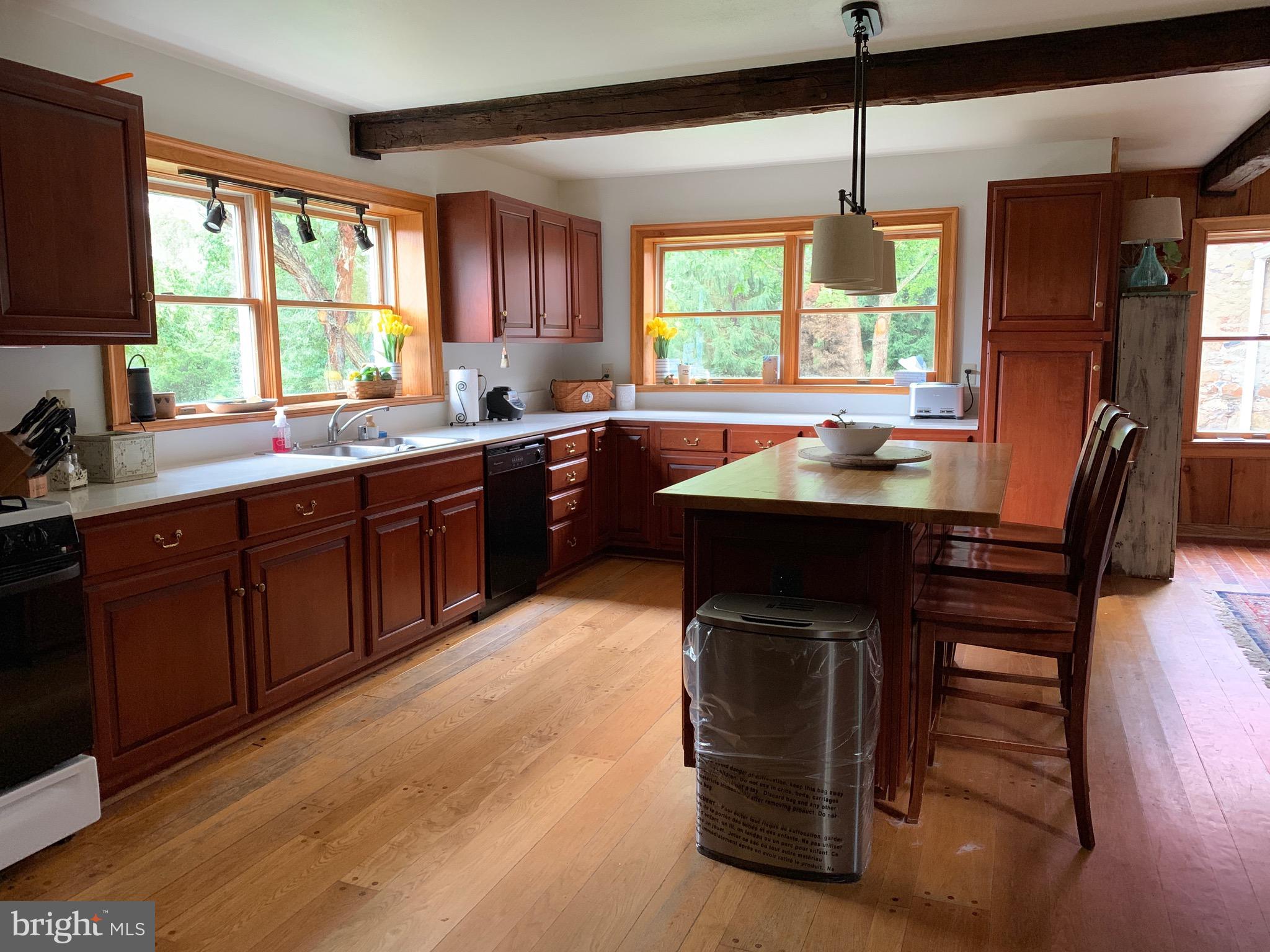 23171 Carters Farm Lane Middleburg, VA 20117 - Photo 4 of 9 a kitchen with a sink a window stainless steel appliances and cabinets