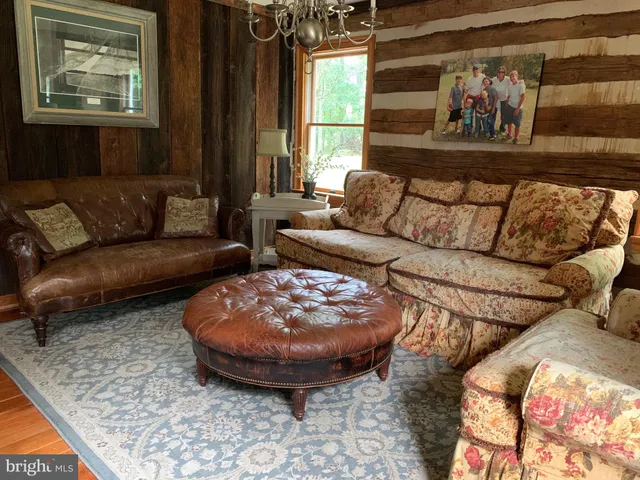 a living room with furniture and a rug