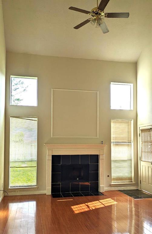 a front view of a room with a fireplace and a window
