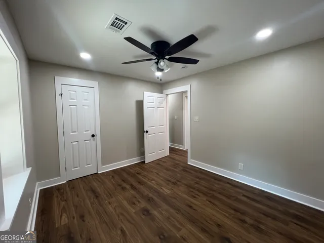 a view of room window and wooden floor