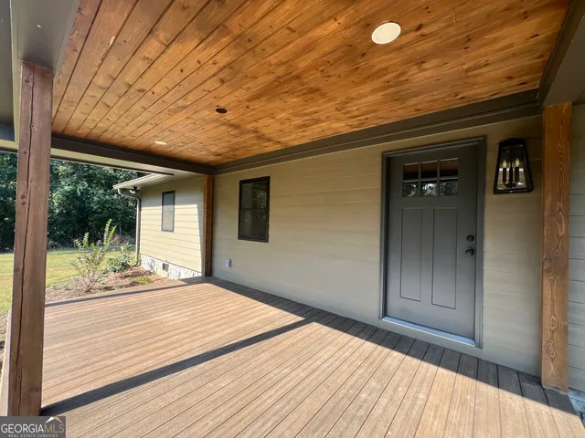 a front view of a house with a porch