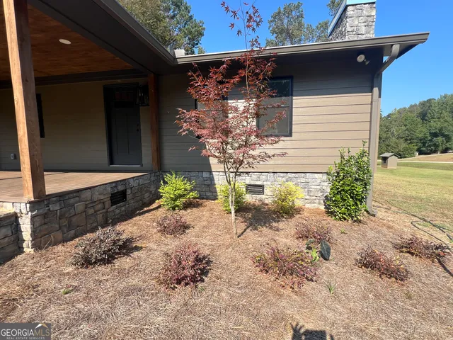 a view of outdoor space with deck and yard
