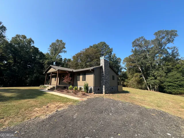 a backyard of a house with wooden fence