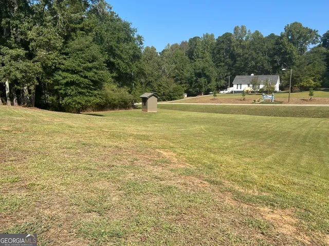 a view of a golf course with a lake