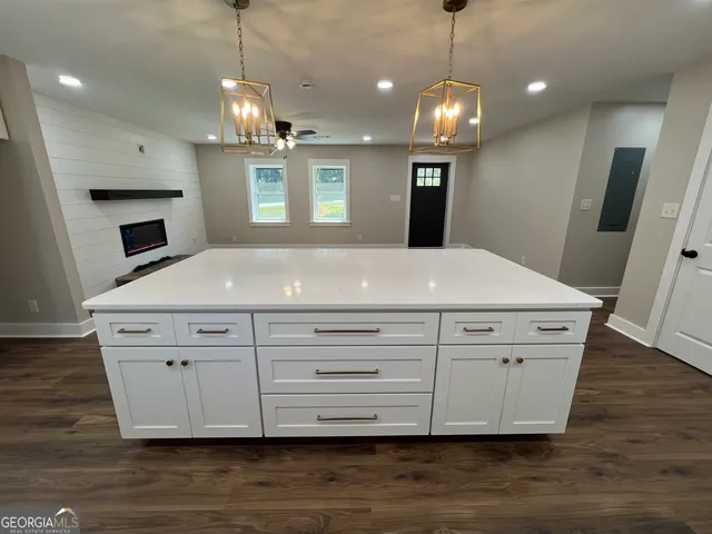 a kitchen with sink cabinets and window