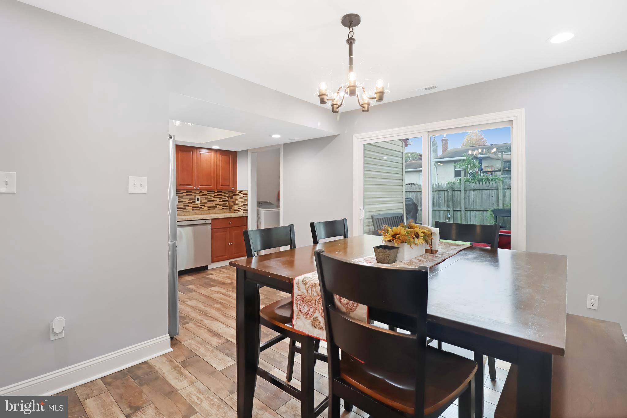 725 Myrtle Avenue Lindenwold, NJ 08021 - Photo 11 of 29 a dining room with furniture a chandelier and window