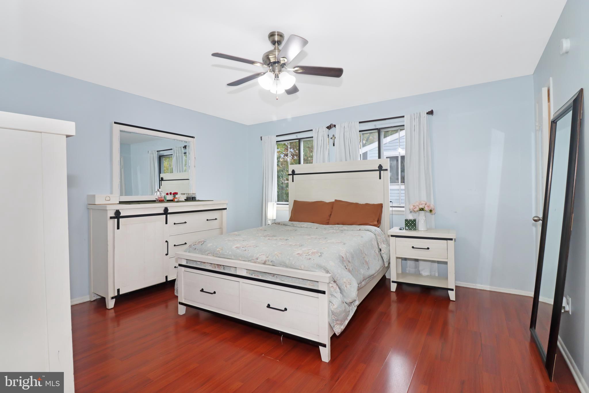 725 Myrtle Avenue Lindenwold, NJ 08021 - Photo 18 of 29 a bedroom with a bed and a chandelier