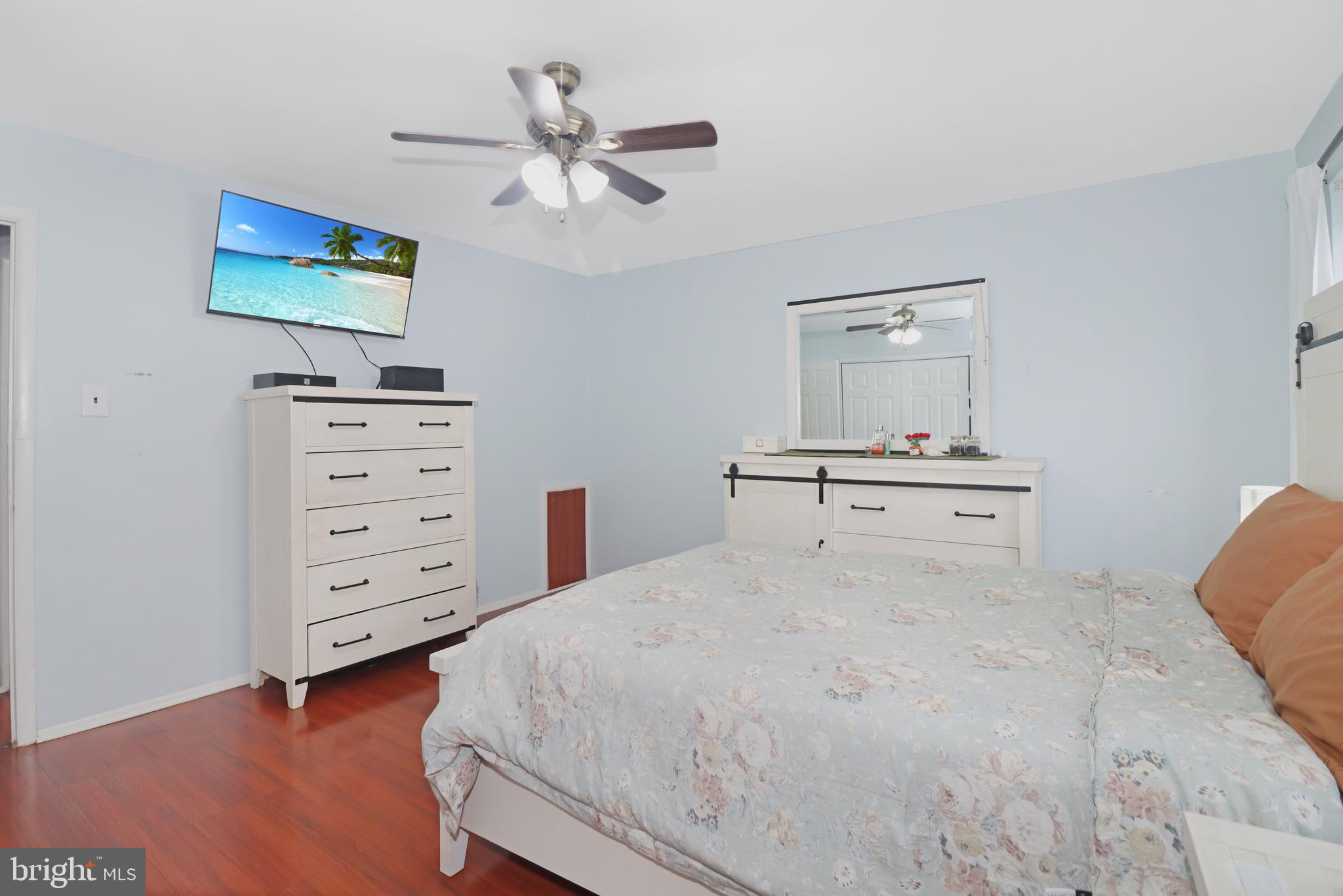 725 Myrtle Avenue Lindenwold, NJ 08021 - Photo 19 of 29 a bedroom with a bed and a chandelier