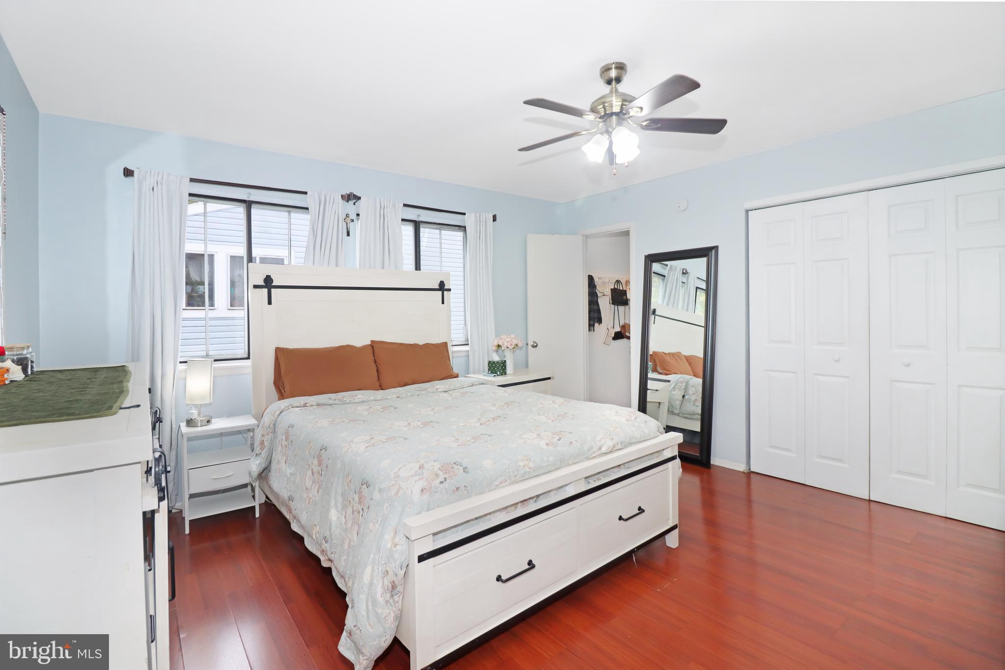 725 Myrtle Avenue Lindenwold, NJ 08021 - Photo 20 of 29 a bed room with a bed and a ceiling fan