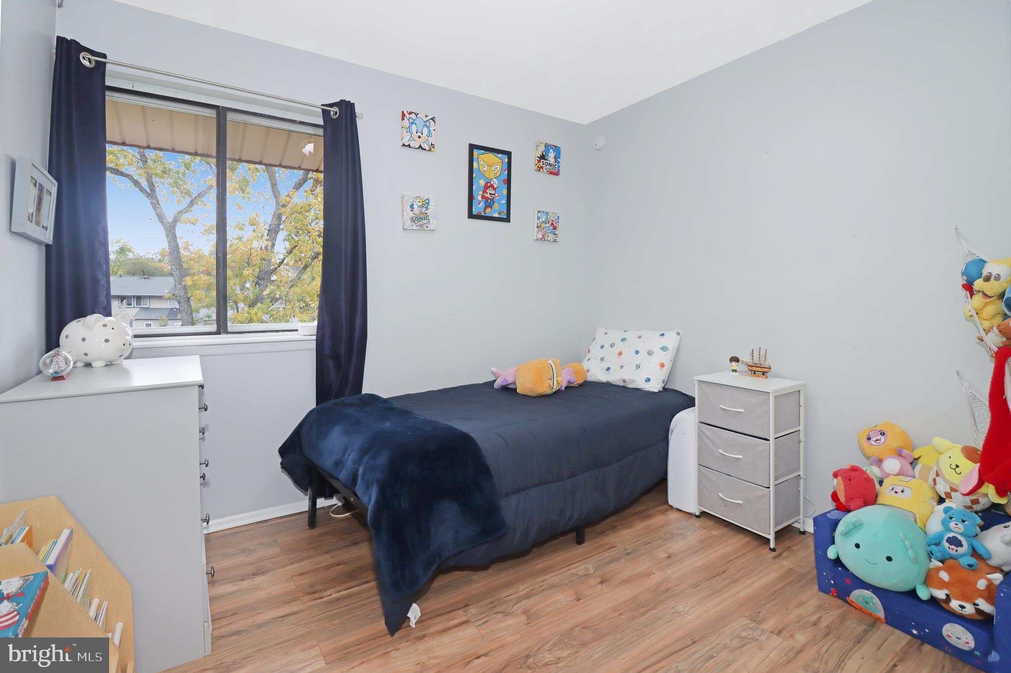 725 Myrtle Avenue Lindenwold, NJ 08021 - Photo 21 of 29 a bedroom with a bed and a window