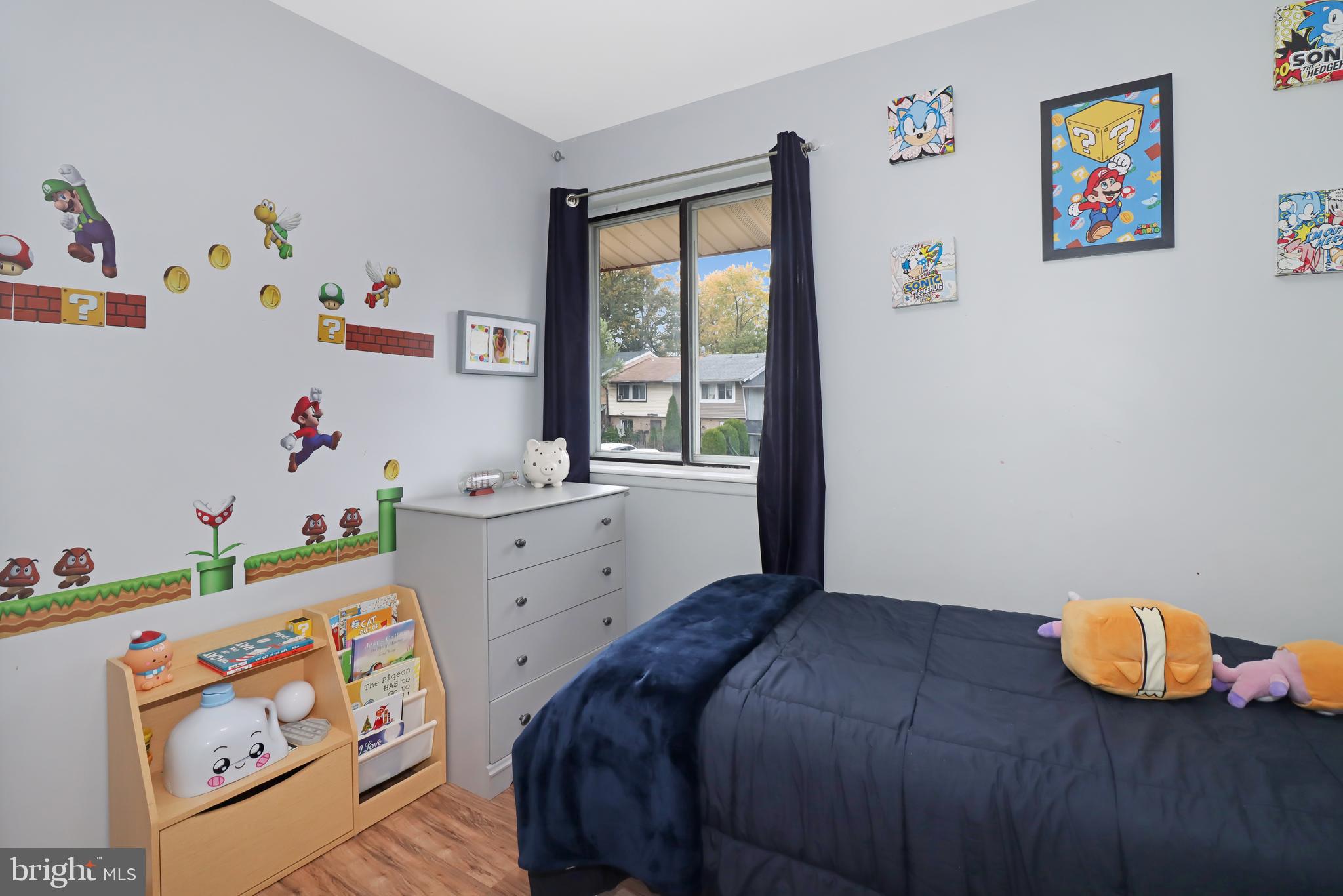 725 Myrtle Avenue Lindenwold, NJ 08021 - Photo 22 of 29 a bedroom with a bed and a window