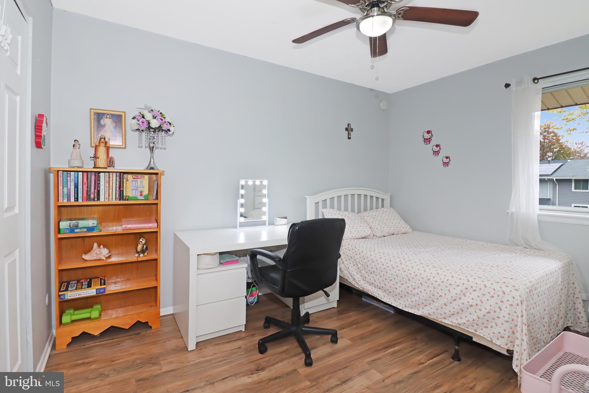 725 Myrtle Avenue Lindenwold, NJ 08021 - Photo 23 of 29 a bedroom with furniture and a wooden floor
