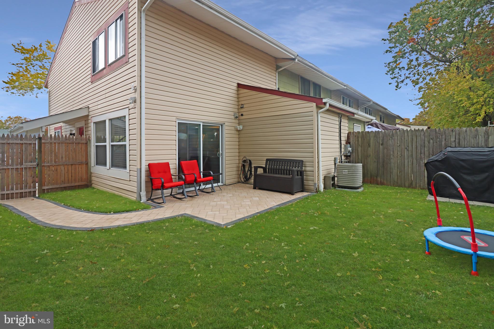 725 Myrtle Avenue Lindenwold, NJ 08021 - Photo 25 of 29 a view of a backyard with furniture and a slide