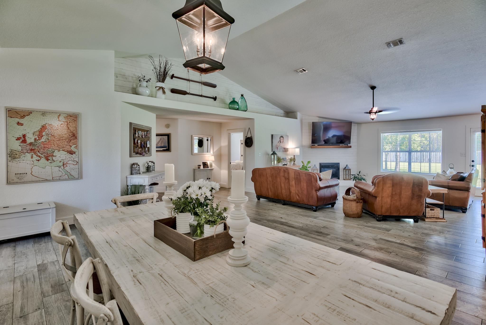 43 East Shipwreck Road Santa Rosa Beach, FL 32459 - Photo 15 of 40 a living room with furniture kitchen view and a chandelier