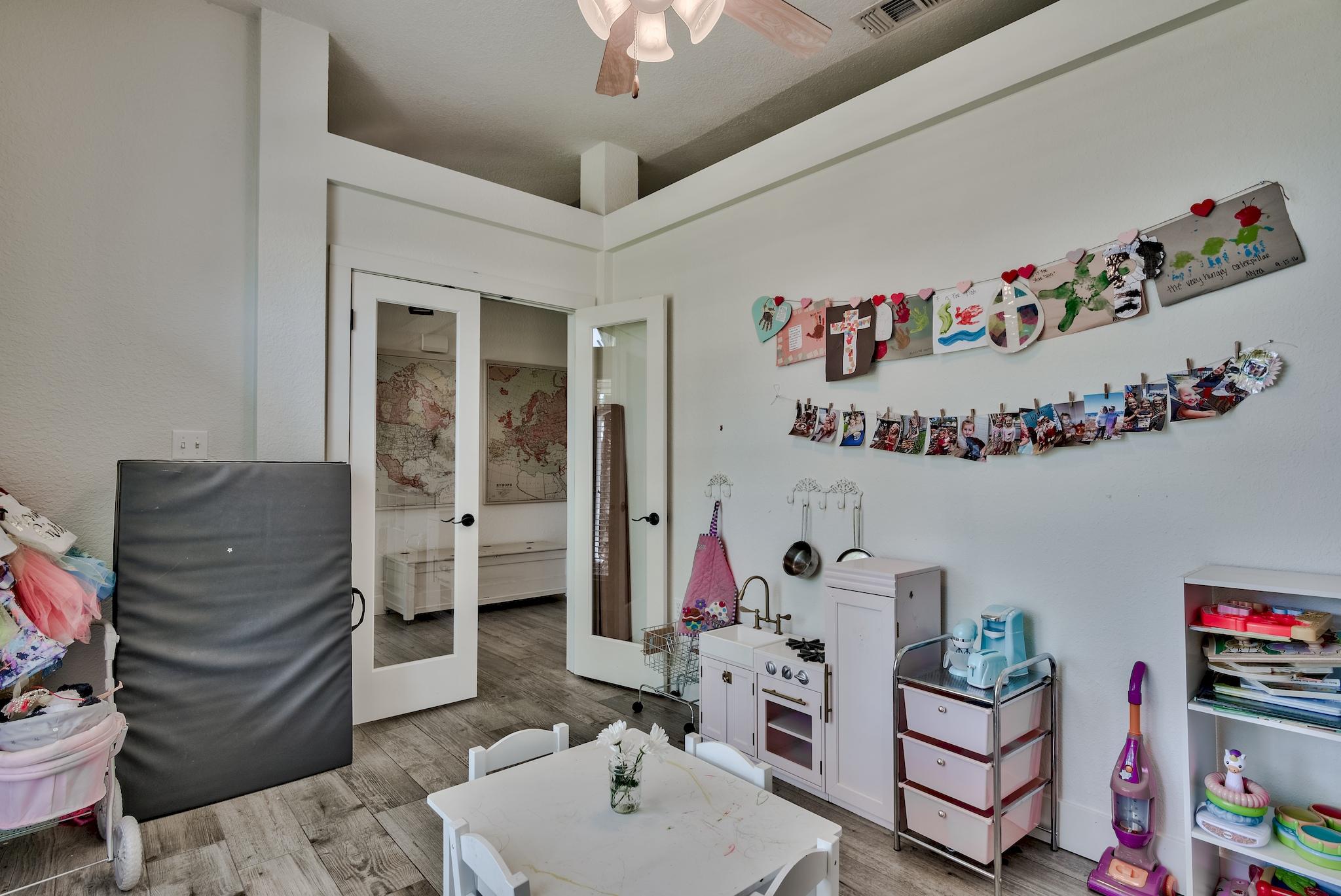 43 East Shipwreck Road Santa Rosa Beach, FL 32459 - Photo 17 of 40 a room with furniture a chandelier and a couch