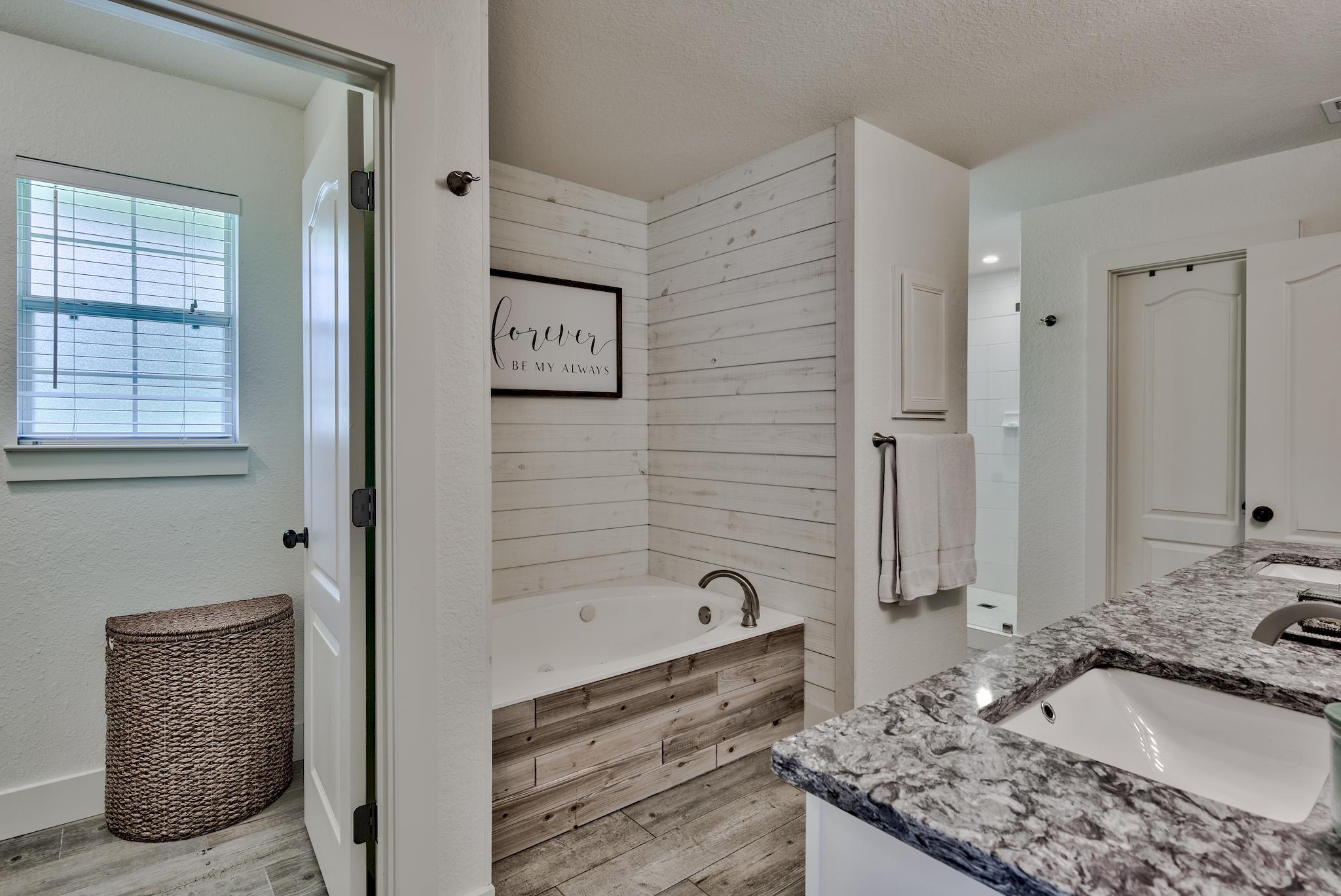 43 East Shipwreck Road Santa Rosa Beach, FL 32459 - Photo 22 of 40 a bathroom with a granite countertop sink and a mirror