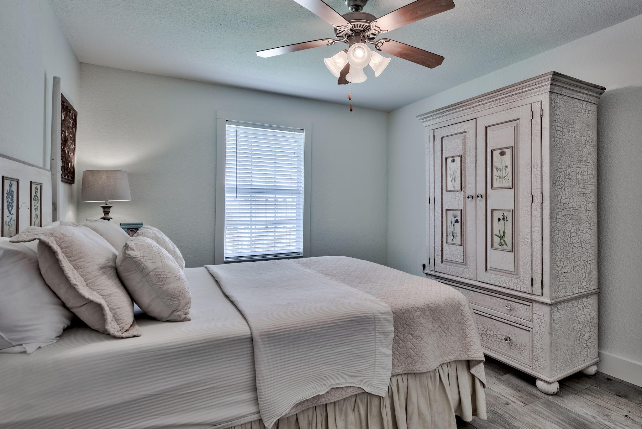 43 East Shipwreck Road Santa Rosa Beach, FL 32459 - Photo 24 of 40 a bedroom with a large bed and ceiling fan