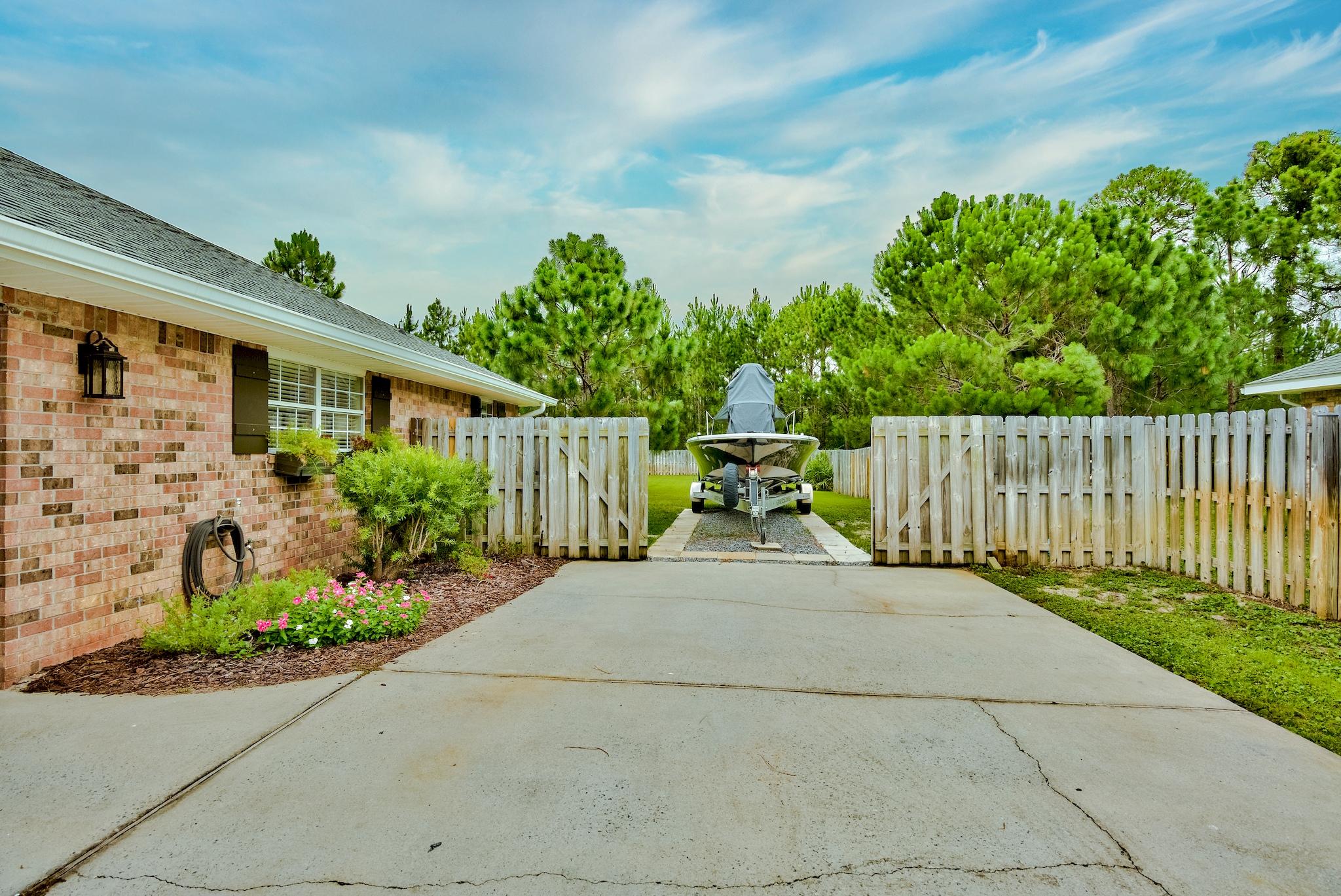 43 East Shipwreck Road Santa Rosa Beach, FL 32459 - Photo 39 of 40 a view of a chair and table in the backyard