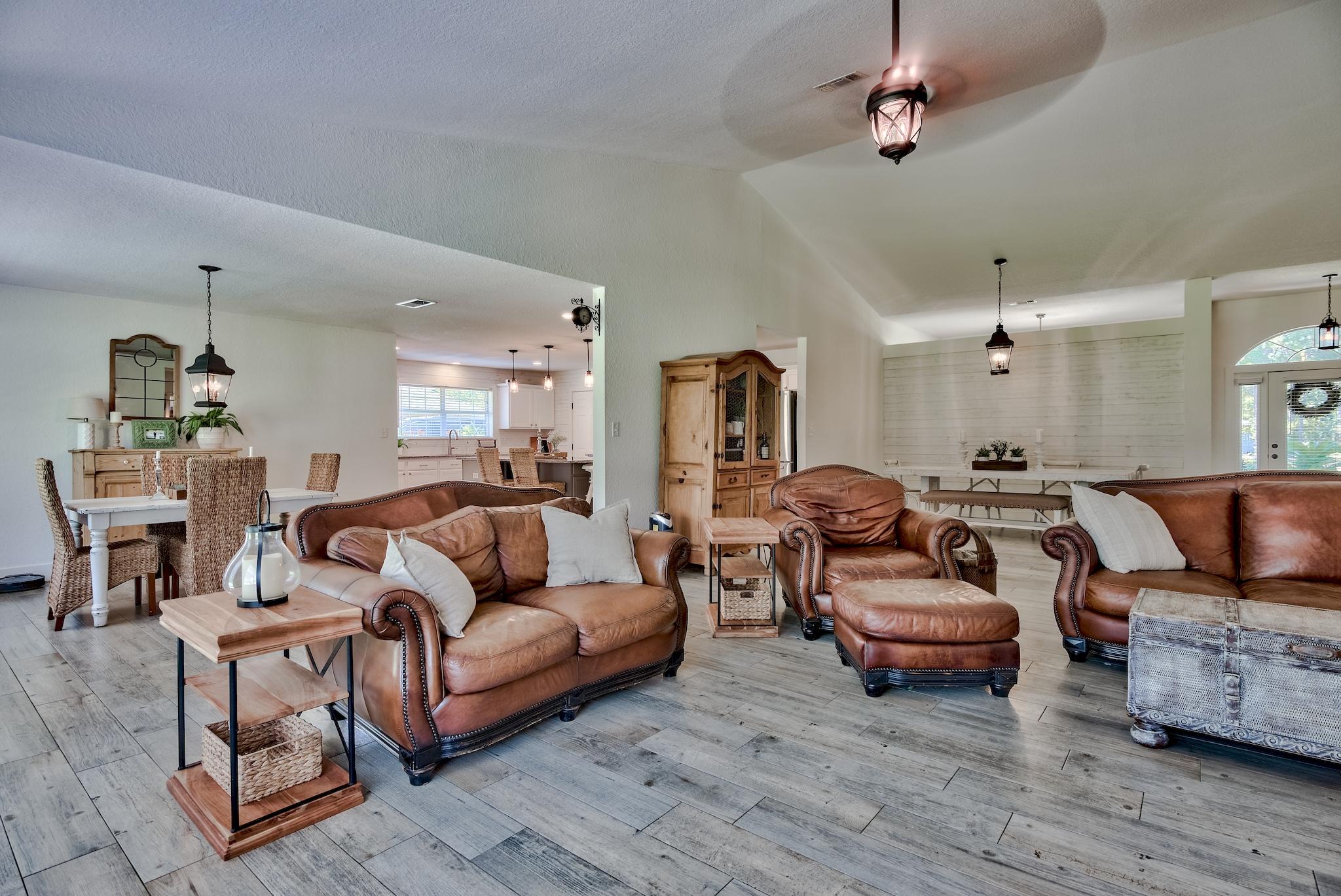 43 East Shipwreck Road Santa Rosa Beach, FL 32459 - Photo 4 of 40 a living room with furniture a ceiling fan and a rug