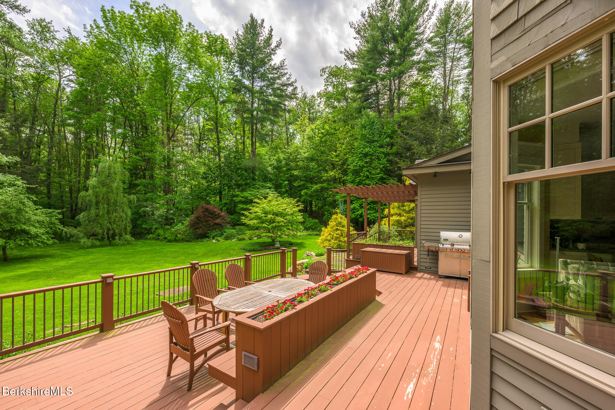 430 Lenox Road Richmond, MA 01254 - Photo 56 of 66 a view of a chairs and table on the wooden deck