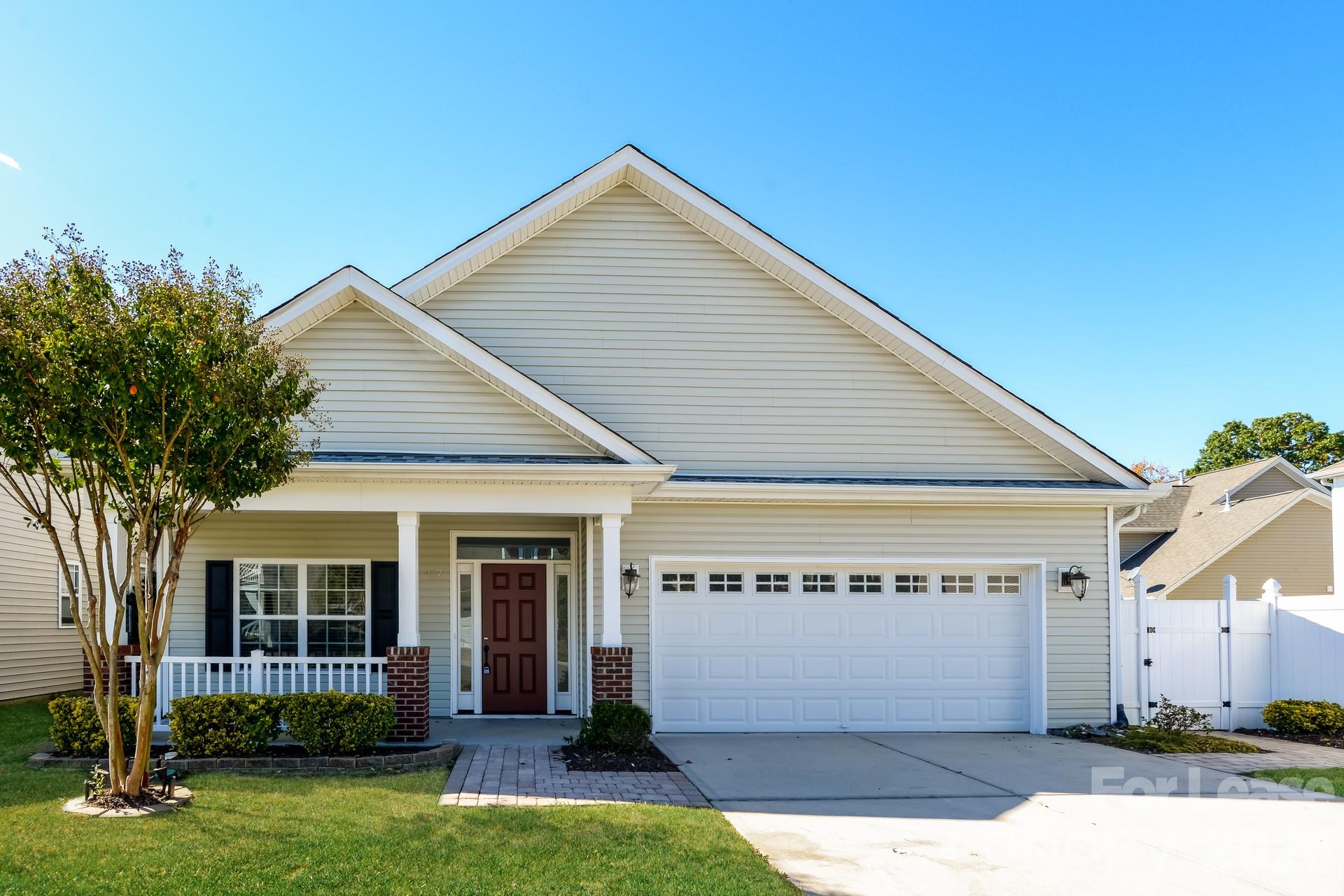 front view of a house with a yard