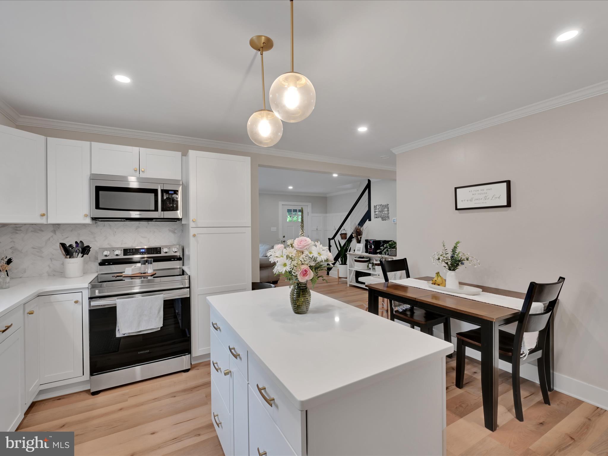 320 Elm Street Lebanon, PA 17042 - Photo 13 of 44 a kitchen with a stove a sink and chairs