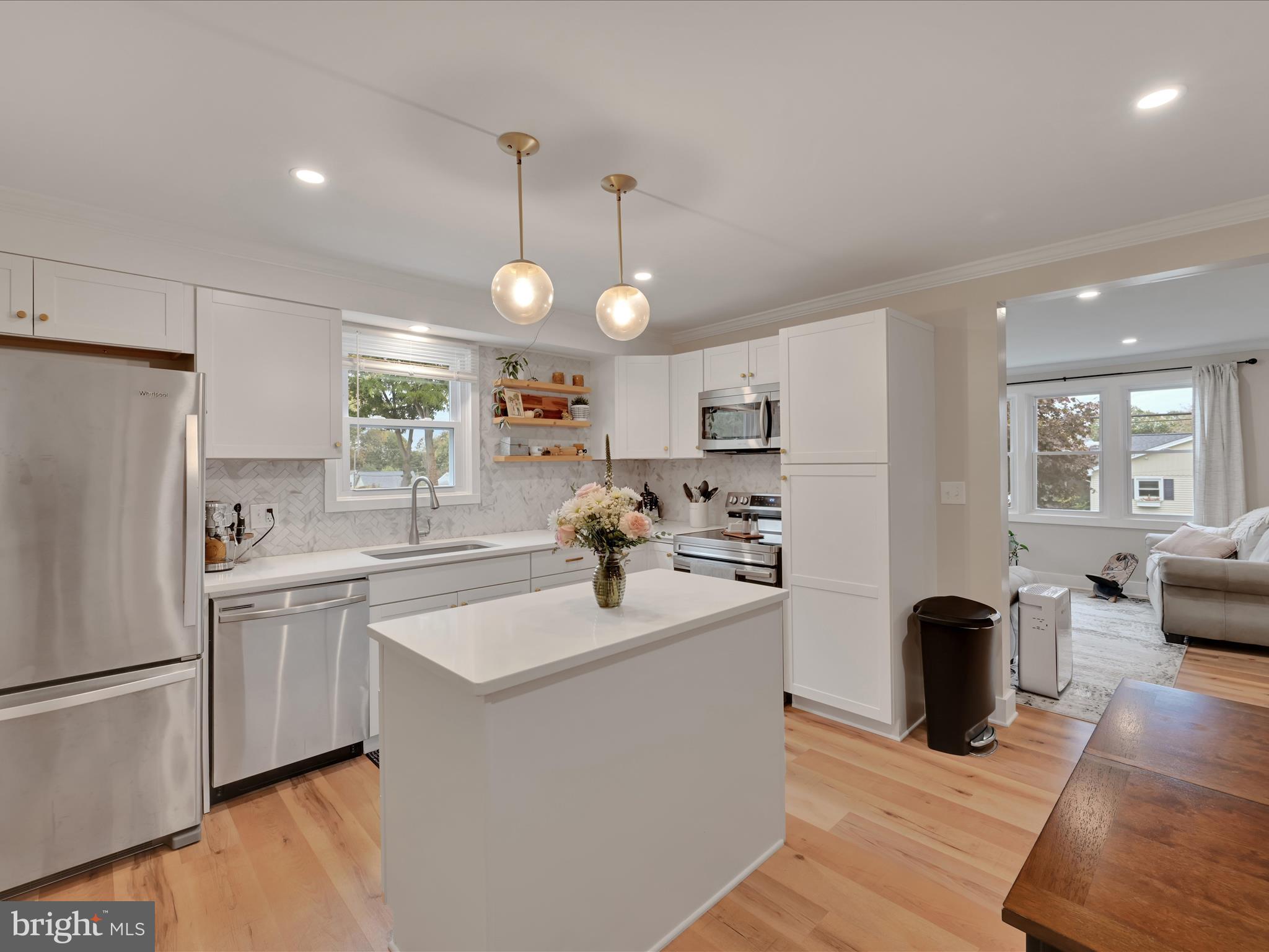 320 Elm Street Lebanon, PA 17042 - Photo 15 of 44 a kitchen with sink a refrigerator and chairs