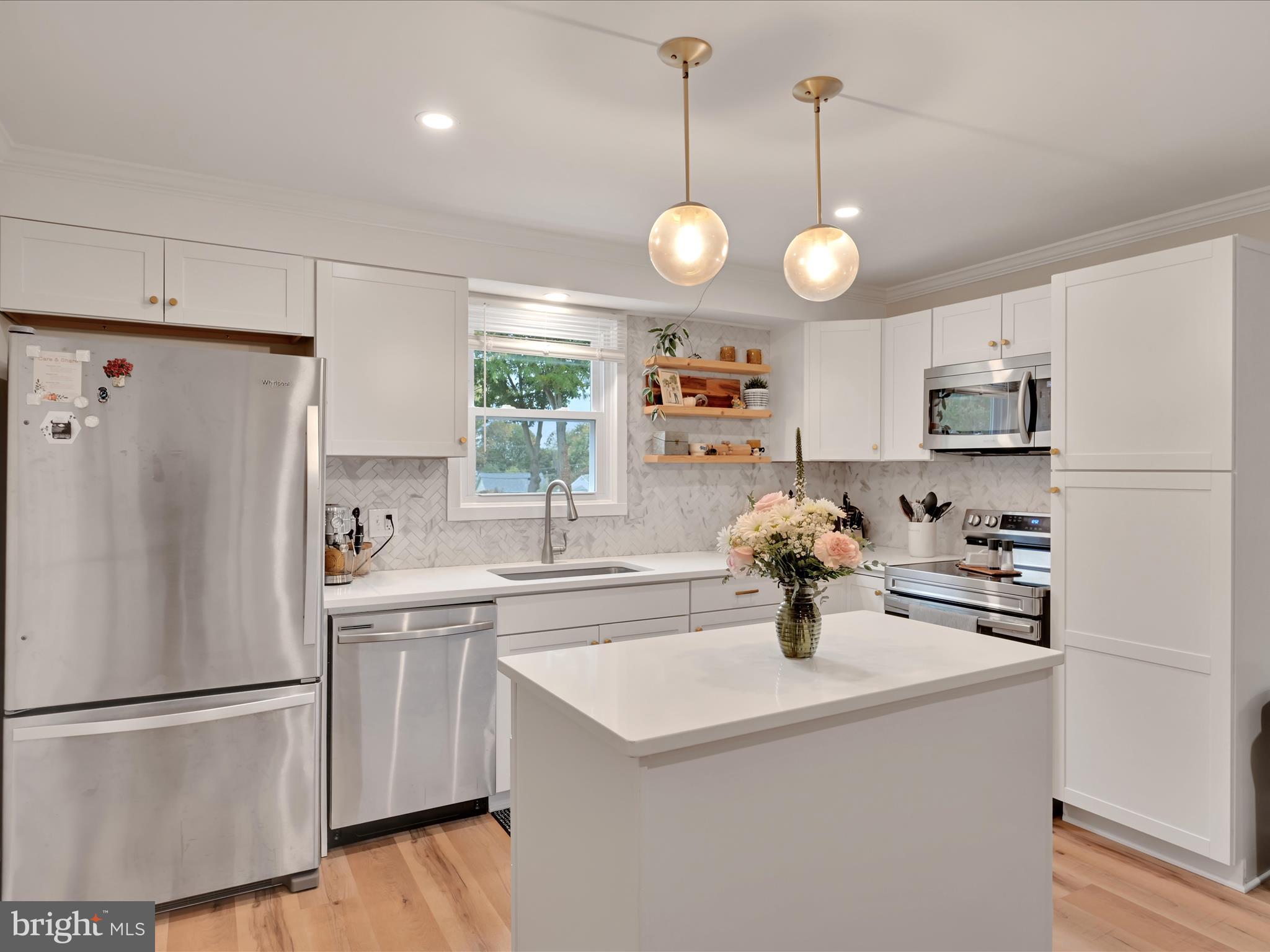 320 Elm Street Lebanon, PA 17042 - Photo 17 of 44 a kitchen with appliances a refrigerator and a stove top oven