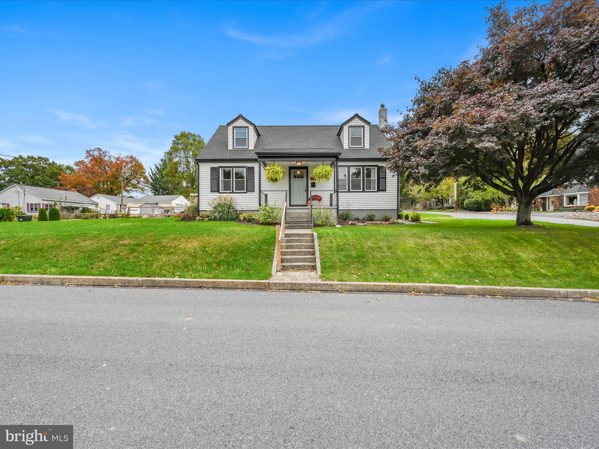 320 Elm Street Lebanon, PA 17042 - Photo 2 of 44 a view of a big house with a big yard and palm trees