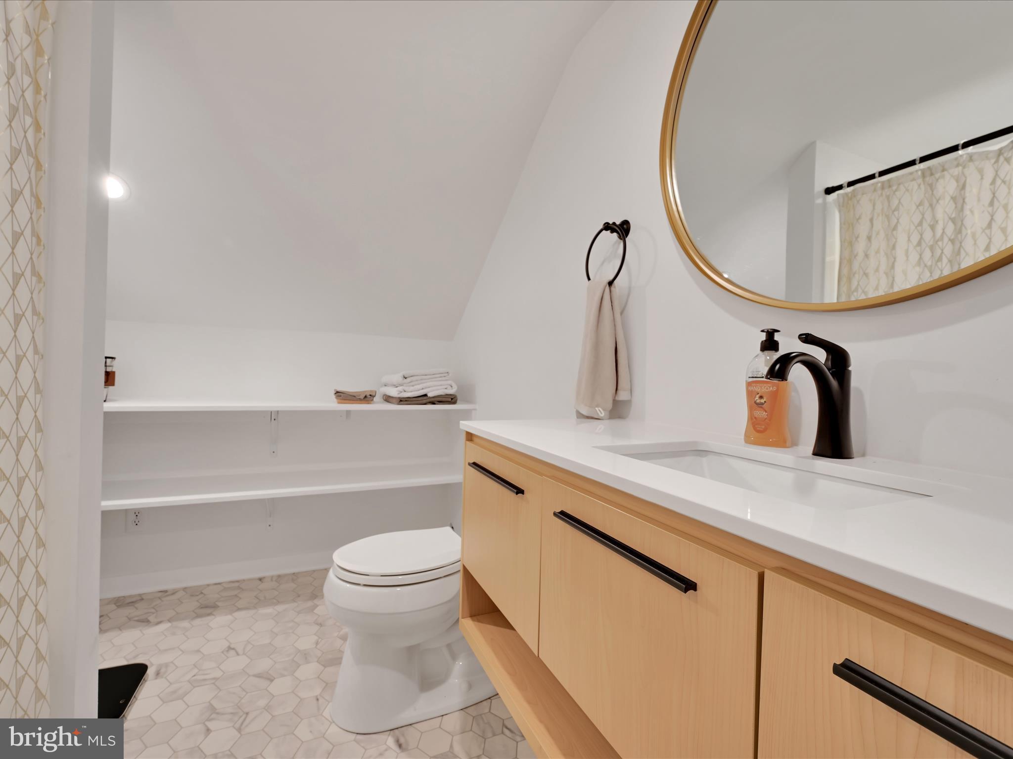 320 Elm Street Lebanon, PA 17042 - Photo 21 of 44 a bathroom with a sink a toilet and a mirror