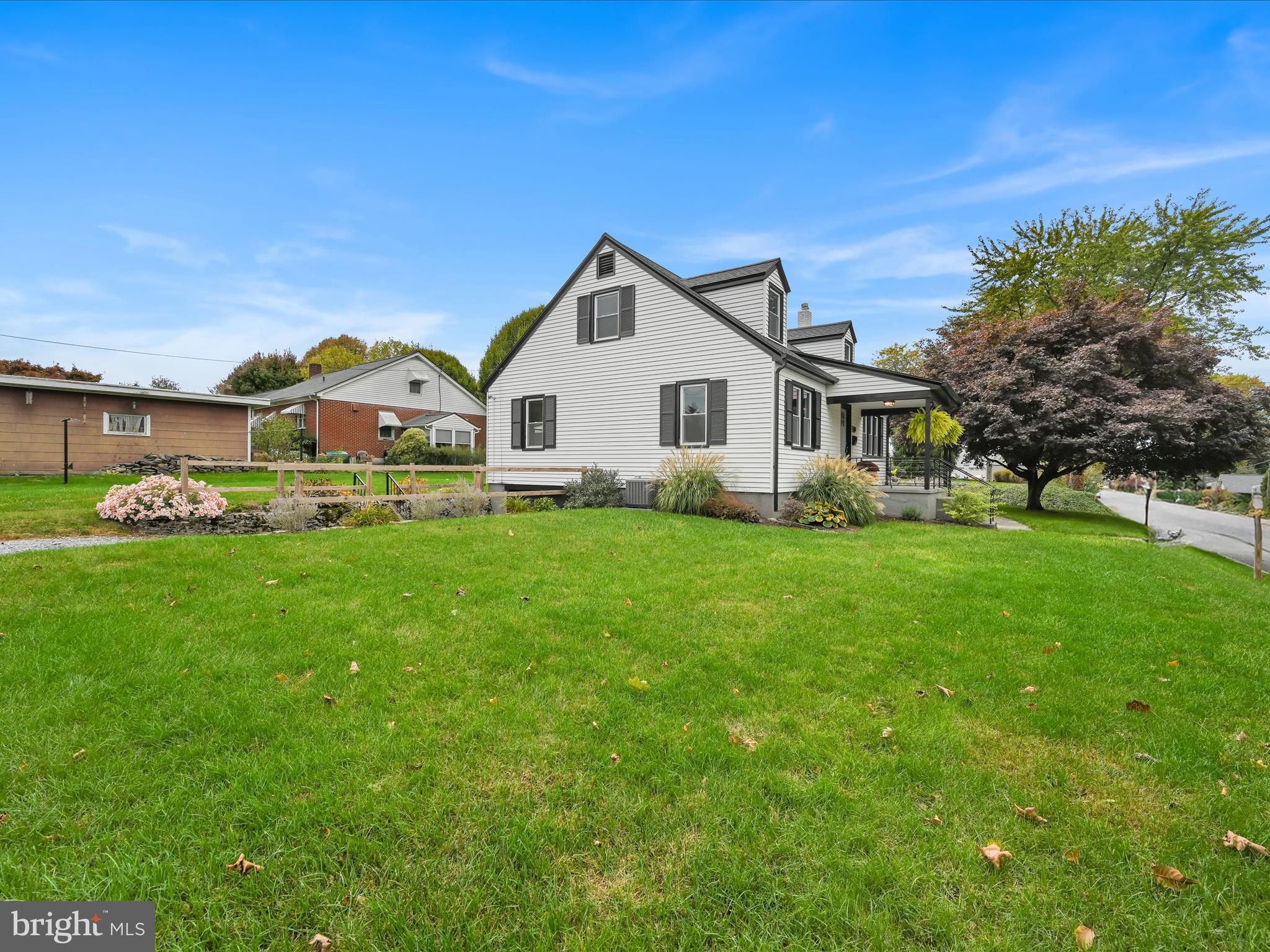 320 Elm Street Lebanon, PA 17042 - Photo 5 of 44 a front view of a house with a garden and trees