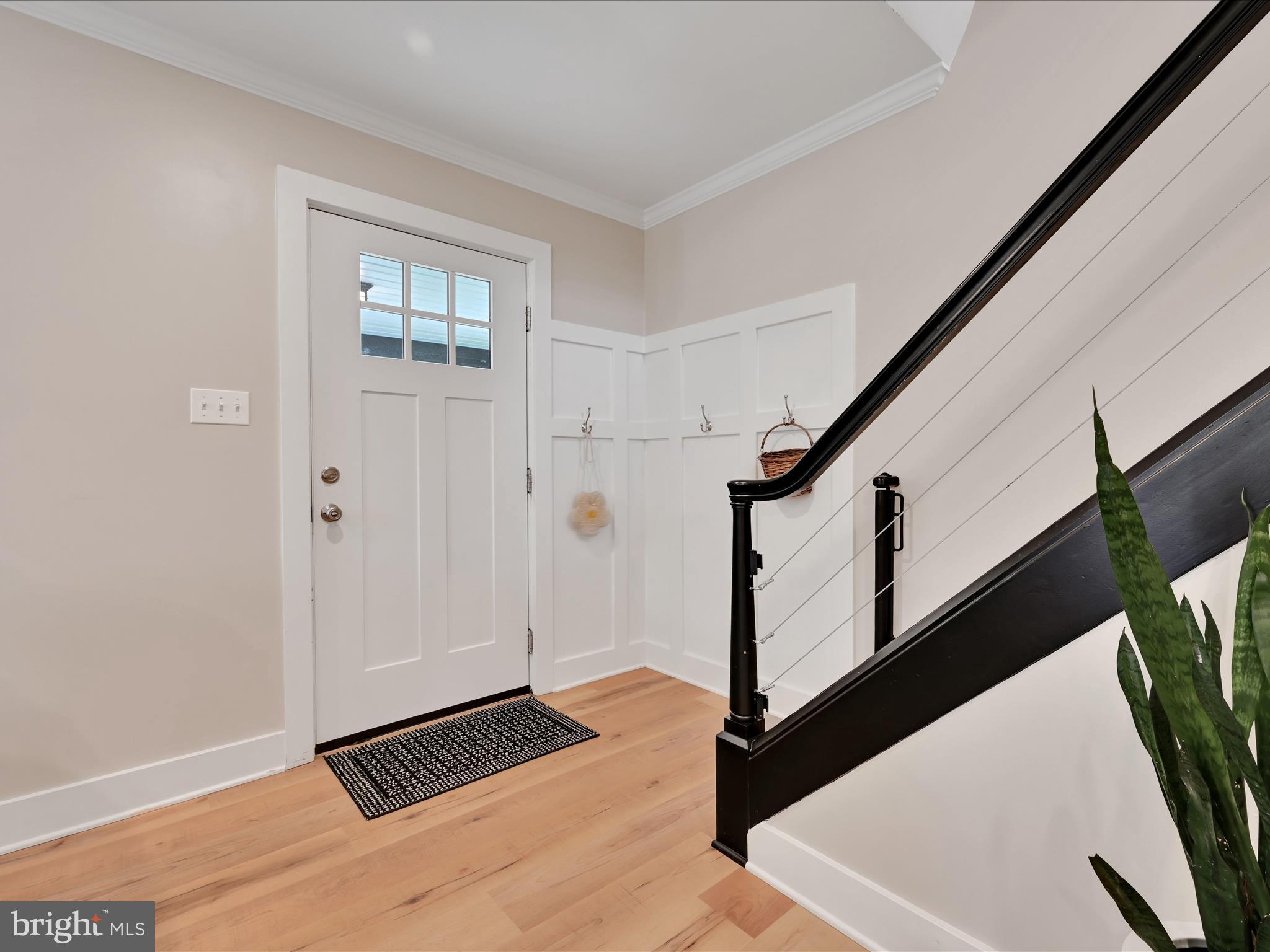 320 Elm Street Lebanon, PA 17042 - Photo 7 of 44 a view of an entryway with wooden floor and stairs