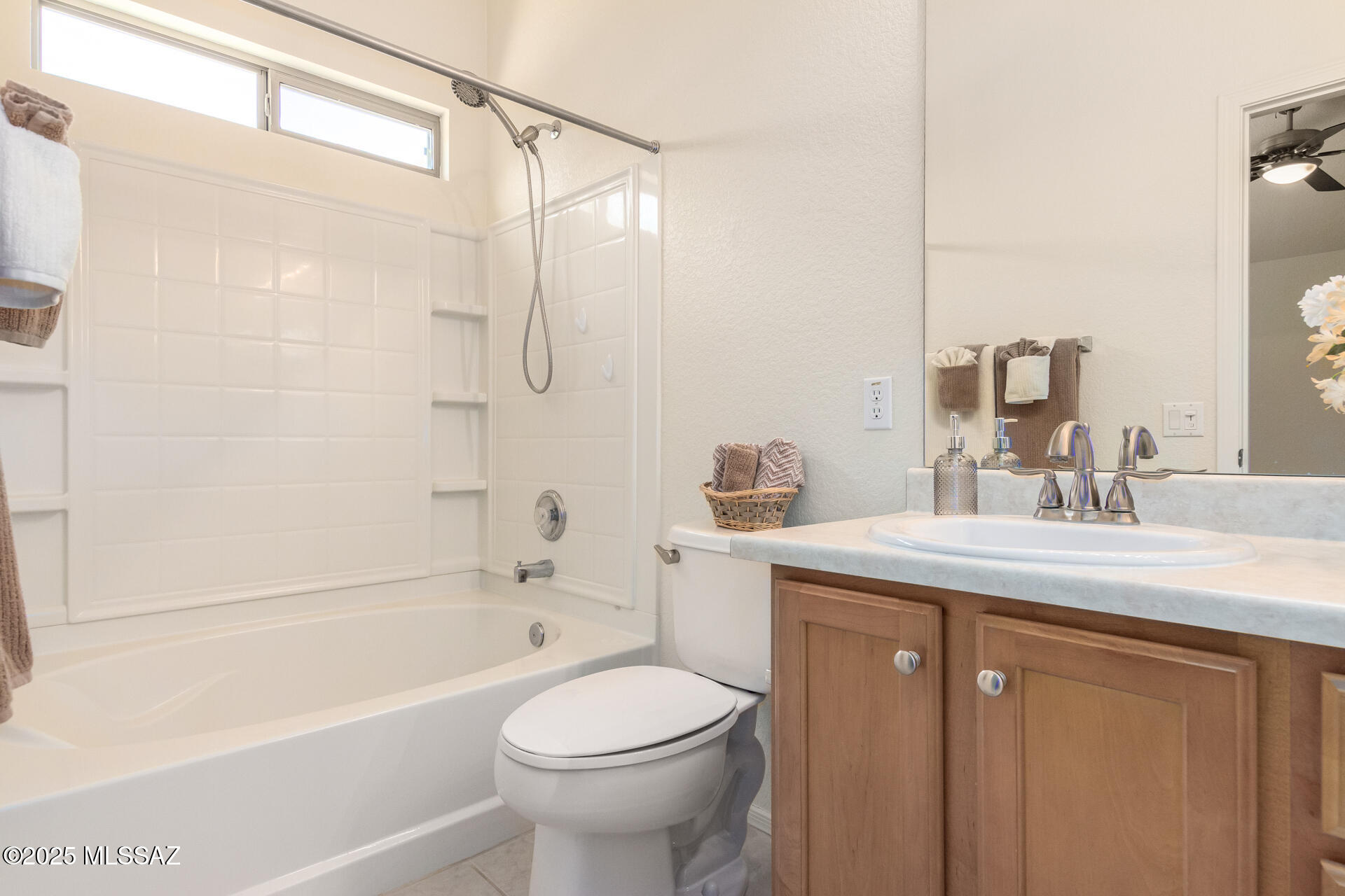 1516 North Old Ranch Road Tucson, AZ 85745 - Photo 17 of 27 a bathroom with a sink a toilet and a bathtub