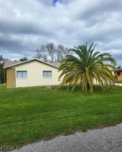 13208 Fourth Street Fort Myers, FL 33905 - Photo 2 of 27 a view of a backyard with plants and large trees