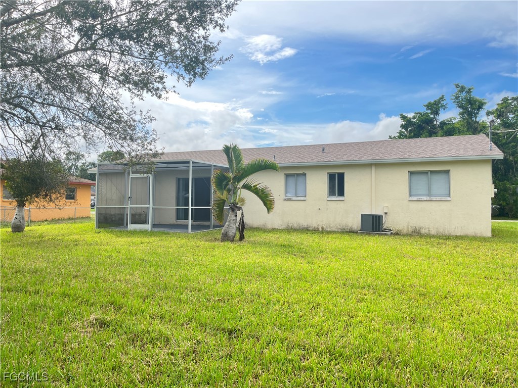13208 Fourth Street Fort Myers, FL 33905 - Photo 25 of 27 front view of a house with a yard