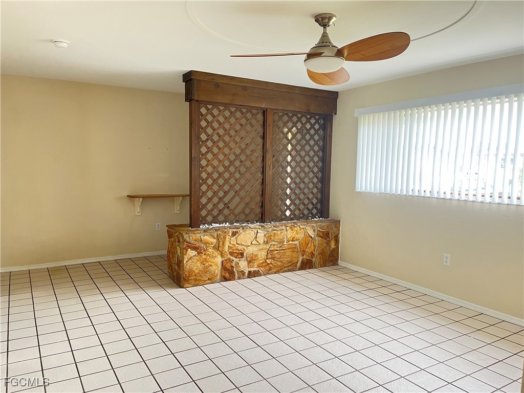 13208 Fourth Street Fort Myers, FL 33905 - Photo 3 of 27 a bedroom with a bed and a window