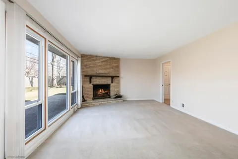 an empty room with fireplace