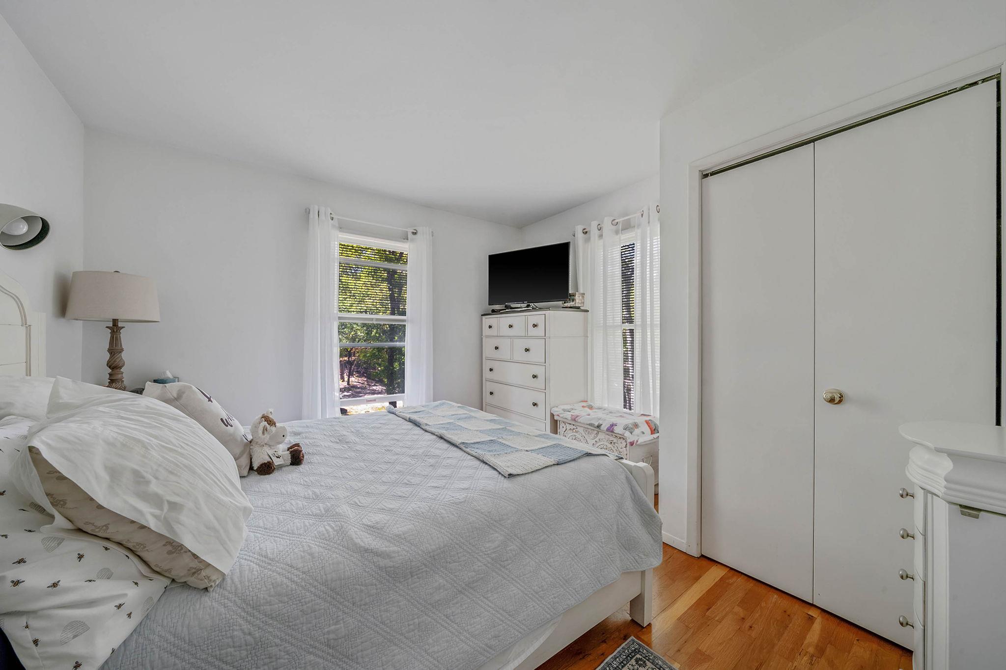 28 Huntting Road East Hampton, NY 11937 - Photo 7 of 14 Bedroom with light wood-type flooring and a closet