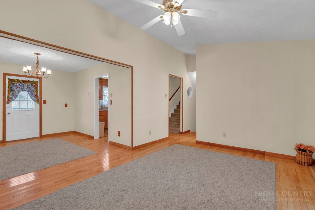 163 Rolling Hill Drive Boone, NC 28607 - Photo 8 of 40 an empty room with fan and entrance