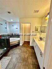 21102 Southwest 88th Court Cutler Bay, FL 33189 - Photo 4 of 15 a bathroom with a sink a mirror and a bathtub
