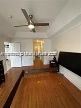 a view of a kitchen with a sink and cabinets
