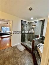 21102 Southwest 88th Court Cutler Bay, FL 33189 - Photo 6 of 15 a bathroom with a tub shower vanity and a sink