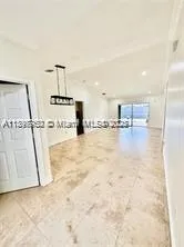 a view of empty room with floor to ceiling window