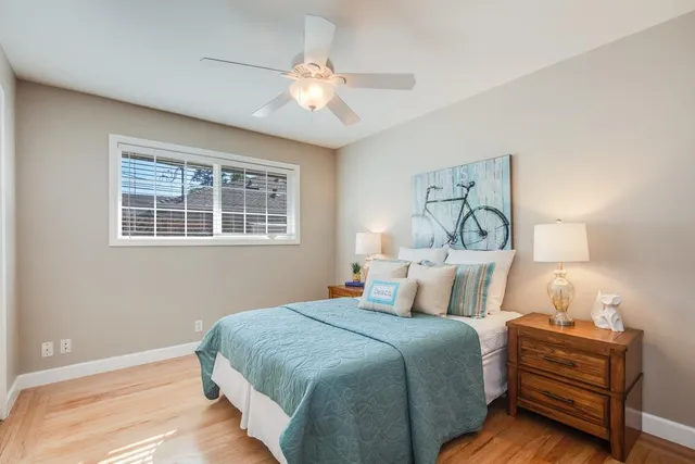 a bedroom with bed and window