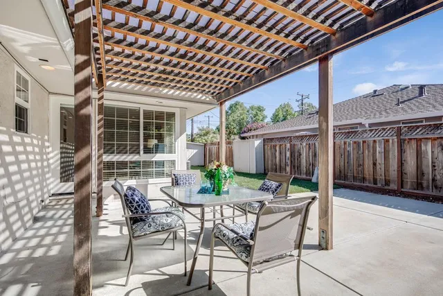 a view of an outdoor space with a table and chairs